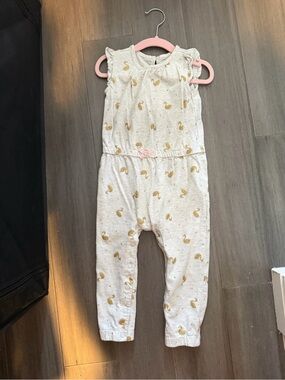 Cream Sleeveless Baby Romper with Gold Swan Print and Pink Bow